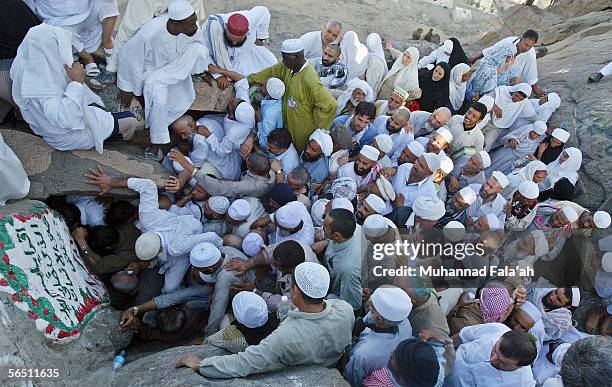 Muslim pilgrims try to enter Heera cave, where according to the Muslims belief, Prophet Muhammad received the revelation of the holy Muslim book the...