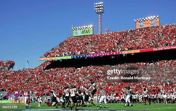 Kicker Jamie Christensen of the Alabama Crimson Tide kicks the game winning field goal against the Texas Tech Red Raiders during the AT&T Cotton Bowl...