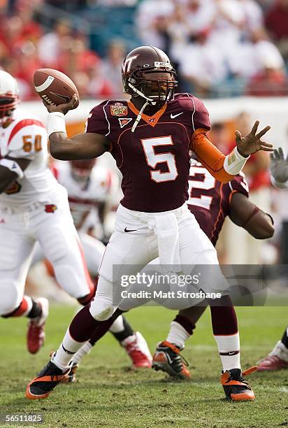 Marcus Vick of the Virginia Tech Hokies drops back to pass against the Louisville Cardinals during the Toyota Gator Bowl on January 2, 2006 at Alltel...