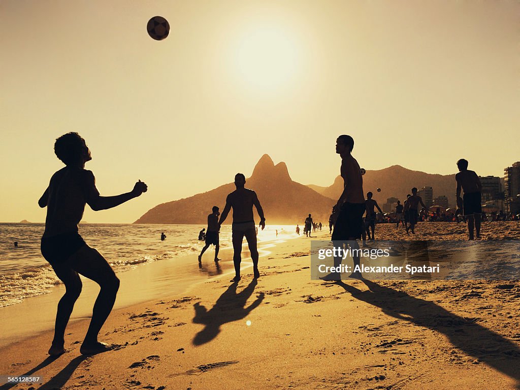 People playing football at Ipanema Beach in Rio