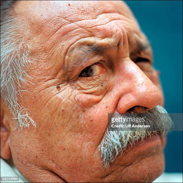 Author Jim Harrison poses while in France during September 2002.