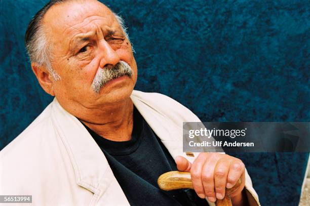 Author Jim Harrison poses while in France during September 2002.