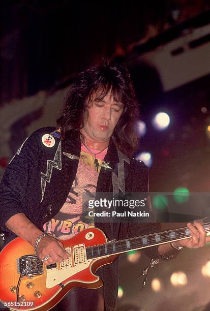 American musician Ace Frehley plays guitar as he performs on stage at the Aragon Ballroom, Chicago, Illinois, September 4, 1987.