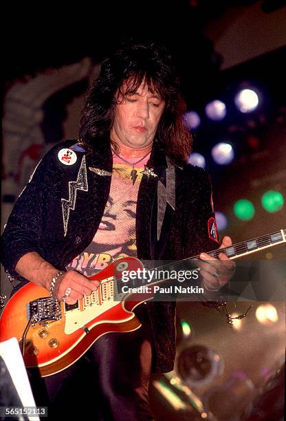 American musician Ace Frehley plays guitar as he performs on stage at the Aragon Ballroom, Chicago, Illinois, September 4, 1987.