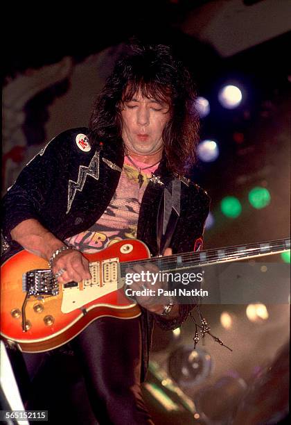 American musician Ace Frehley plays guitar as he performs on stage at the Aragon Ballroom, Chicago, Illinois, September 4, 1987.