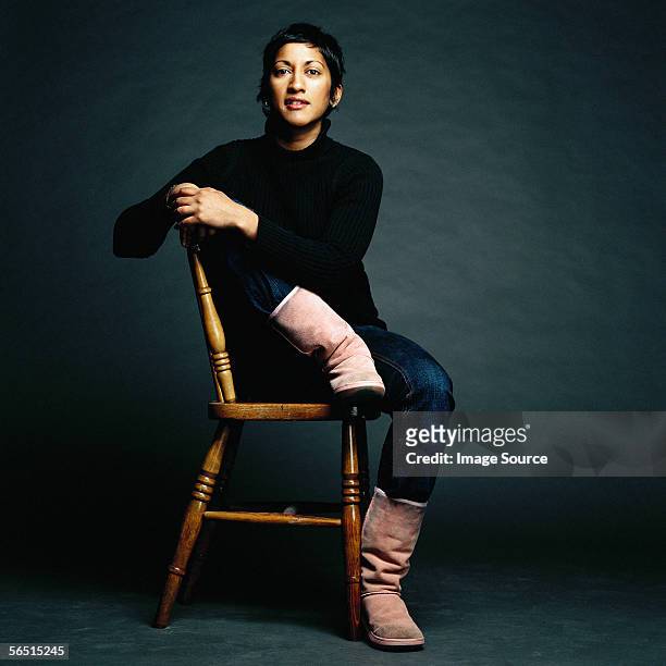 portrait of woman on a chair - chairs in studio stockfoto's en -beelden