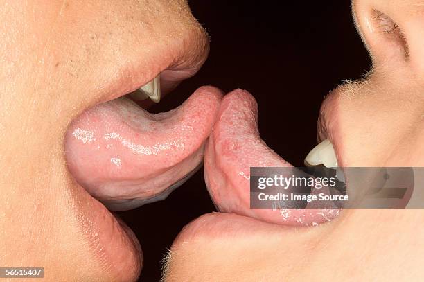 lesbians kissing - tongue kissing stock pictures, royalty-free photos & images