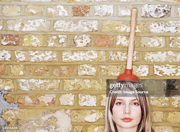 woman with plunger on her head - plunger stock pictures, royalty-free photos & images