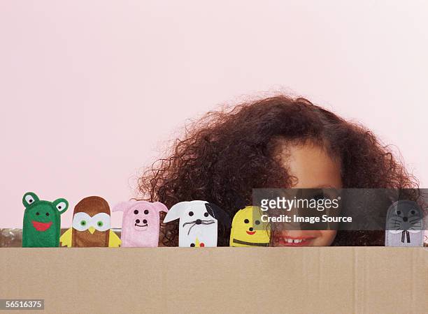 girl with animal finger puppets - puppet show stock pictures, royalty-free photos & images
