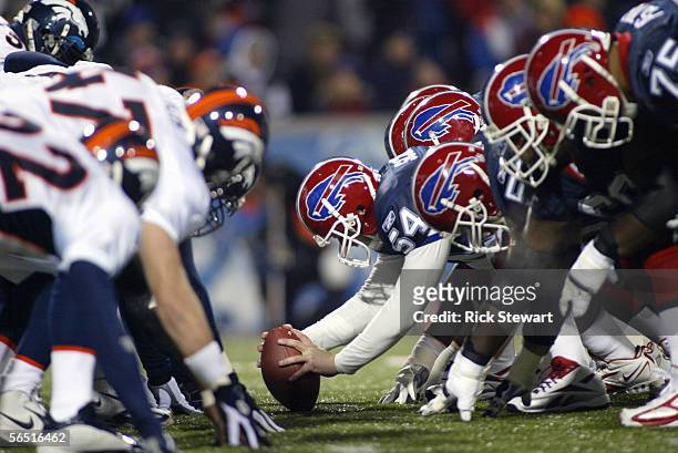 Mike Schneck of the Buffalo Bills is set to hike the ball during the NFL game with the Denver Broncos on December 17, 2005 at Ralph Wilson Stadium in...