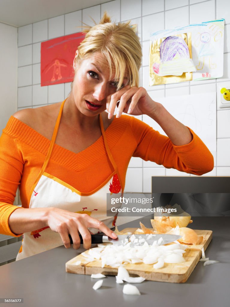 Woman Chopping Onions And Crying High-Res Stock Photo - Getty Images