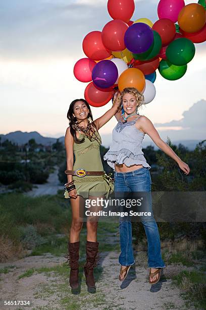 women being lifted by balloons - lustig bunt bildbanksfoton och bilder