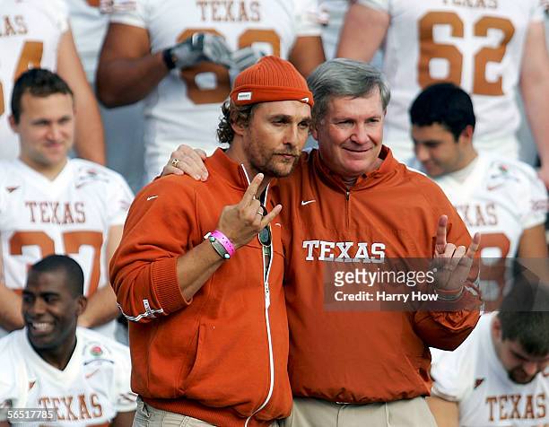 Actor Matthew McConaughey poses with University of Texas head coach Mack Brown during a team photo at the Rose Bowl January 3, 2006 in Pasadena,...