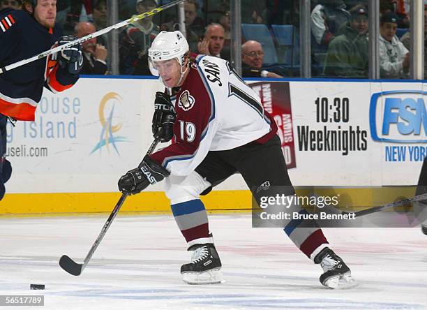 Joe Sakic of the Colorado Avalanche skates with the puch during the game against the New York Islanders at the Nassau Coliseum on December 17, 2005...