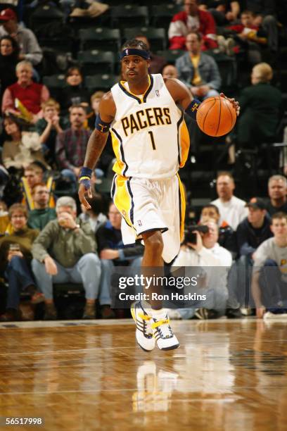 Stephen Jackson of the Indiana Pacers moves the ball up court during a game against the Memphis Grizzlies at Conseco Fieldhouse on December 10, 2005...