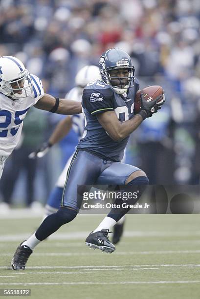 Wide receiver Darrell Jackson of the Seattle Seahawks carries the ball against the Indianapolis Colts at Qwest Field on December 24, 2005 in Seattle,...