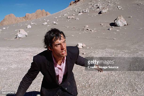 businessman in desert - desertman stock pictures, royalty-free photos & images