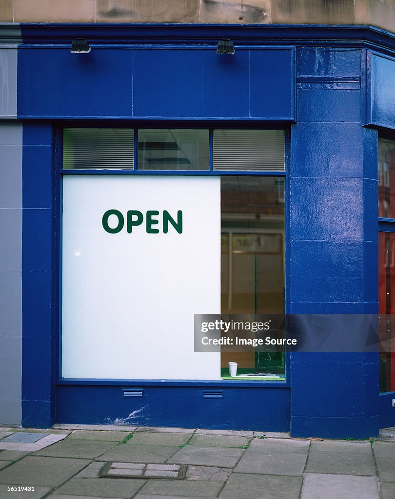 An open sign in a shop