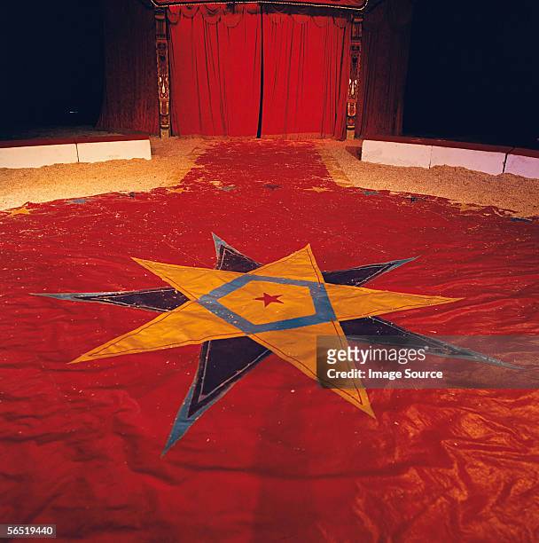 star shape on circus tent floor - circus curtains stock pictures, royalty-free photos & images