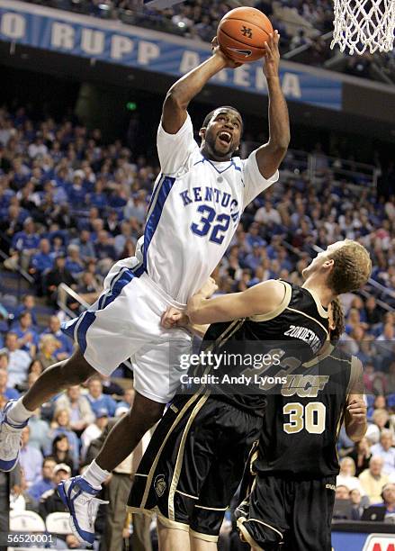 Joe Crawford of the Kentucky Wildcats shoots the ball while defended by Kenrick Zondervan of the Central Florida Golden Knights during the Kentucky...