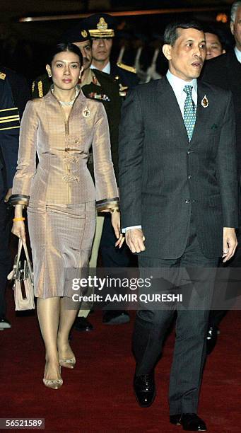 Thailand's Crown Prince Maha Vajiralongkorn is accompanied by his Consort Princess Srirasm as they arrive at Chaklala Airbase in Rawalpindi, 04...