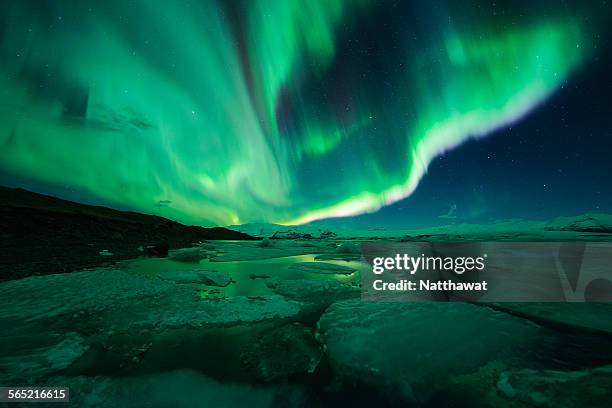 aurora display over the glacier lagoon jokulsarlon - jokulsarlon lagoon ストックフォトと画像