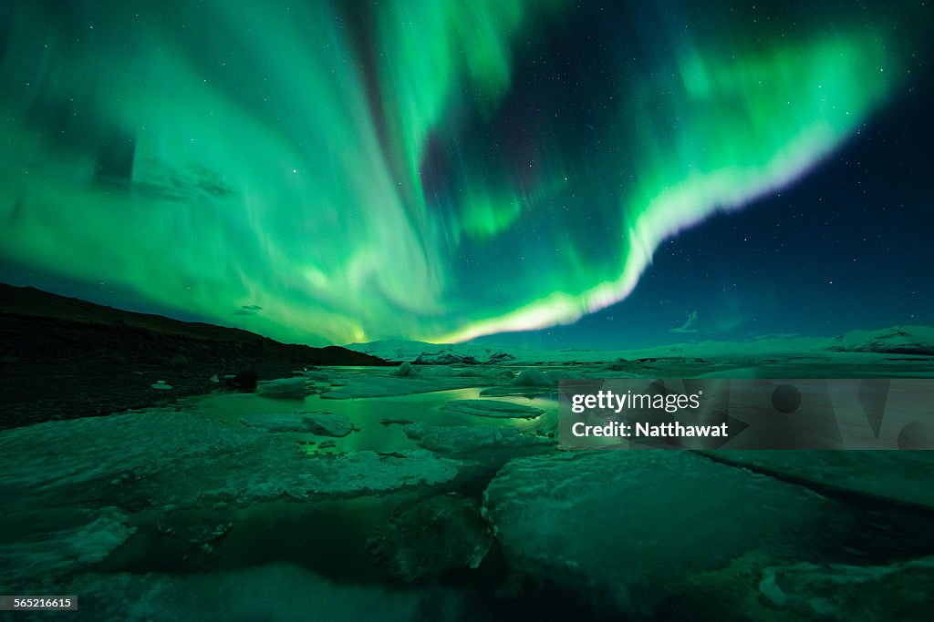 Aurora display over the glacier lagoon Jokulsarlon