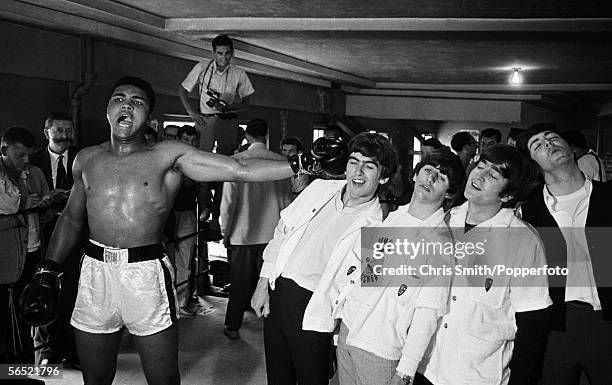 American heavyweight boxer Cassius Clay takes on the Beatles in Miami, during the run-up to his title fight against Sonny Liston, 22nd February 1964.