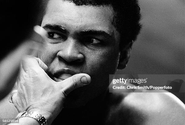 American heavyweight boxing champion Muhammad Ali being fitted with a mouthguard at his training camp at Deer Lake, in the mountains of Pennsylvania,...