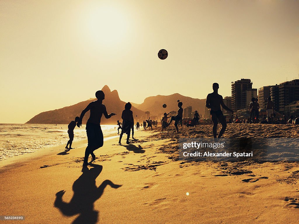 People playing football on Ipanema beach in Rio