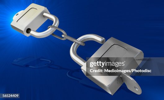 Two padlocks interlocked Two padlocks interlocked
