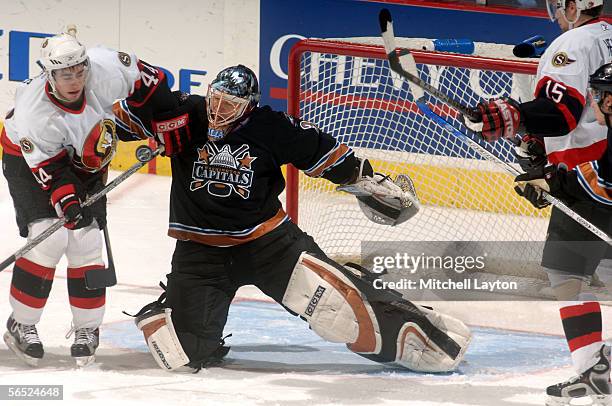 Olaf Kolzig of the Washington Capitals saves a shot in front of Patrick Eaves of the Ottawa Senators during the first period of their NHL game on...