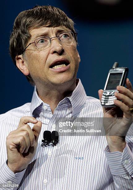 Microsoft Chairman Bill Gates holds a new Palm Treo 700w Smartphone with Verizon service as he delivers the opening keynote address at the 2006...