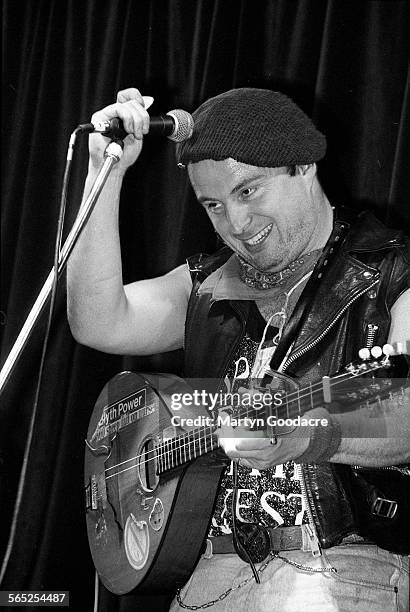 Attila The Stockbroker performs on stage, Comedy Tent, Glastonbury Festival, United Kingdom, 1990.