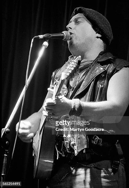 Attila The Stockbroker performs on stage, Comedy Tent, Glastonbury Festival, United Kingdom, 1990.