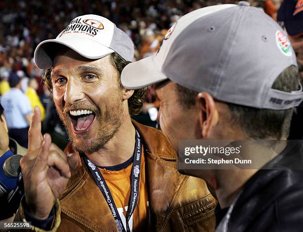 Actor Matthew McConaughey and cyclist Lance Armstrong celebrate after the Texas Longhorns defeated the USC Trojans 41-38 to win the BCS National...