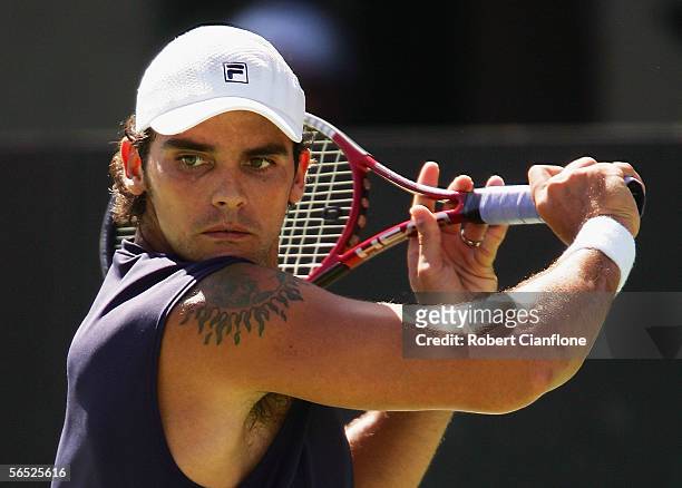 Mark Philippoussis of Australia in action against Dominik Hrbaty of Slovakia on day four of the Next Generation Men's Hardcourts at Memorial Drive on...