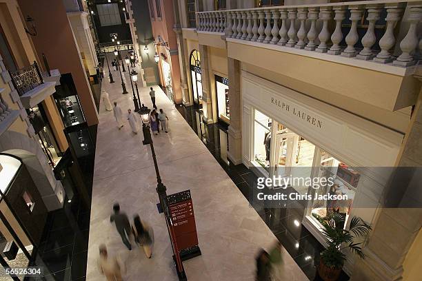 People walk past designer shops in the interior of the newly constucted Emirates Mall December 15, 2005 in Dubai, United Arab Emirates. The Emirates...