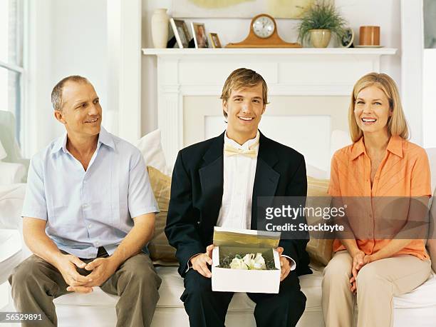 portrait of a son sitting with his parents - receding stock pictures, royalty-free photos & images