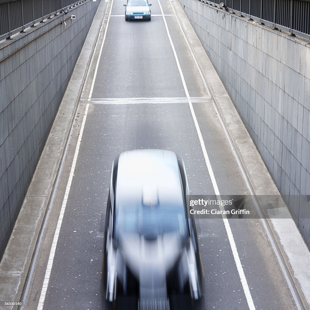 High angle view of a taxi cab entering a tunnel