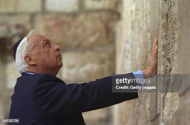 In this handout provided by the Israeli Governmental Press Office, Israeli Prime Minister elect Ariel Sharon prays the day after his election victory...