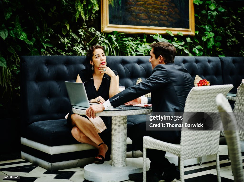 Businesswoman and businessman in lunch meeting