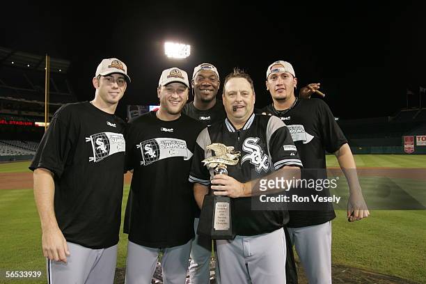 Jon Garland, Mark Buehrle, Jose Contreras, pitching coach Don Cooper and Freddy Garcia of the Chicago White Sox celebrate after winning Game 5 of the...