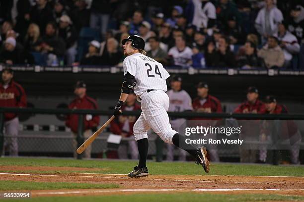 Joe Crede of the Chicago White Sox hits a solo home run in the fourth inning during Game 1 of the 2005 World Series against the Houston Astros at US...