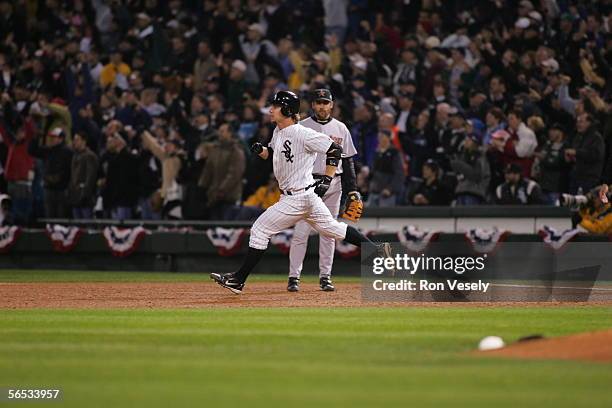 Joe Crede of the Chicago White Sox hits a solo home run in the fourth inning during Game 1 of the 2005 World Series against the Houston Astros at US...