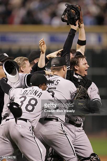 Pierzynski of the Chicago White Sox leads the way as the White Sox celebrate winning Game 4 of the 2005 World Series against the Houston Astros at...