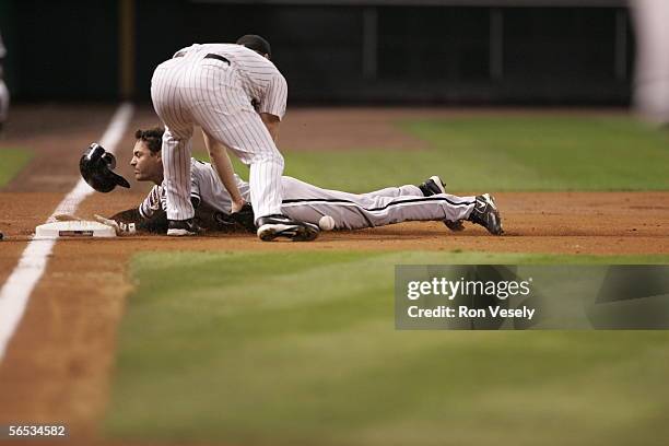 Scott Podsednik of the Chicago White Sox hits a triple in the third inning during Game 4 of the 2005 World Series against the Houston Astros at...