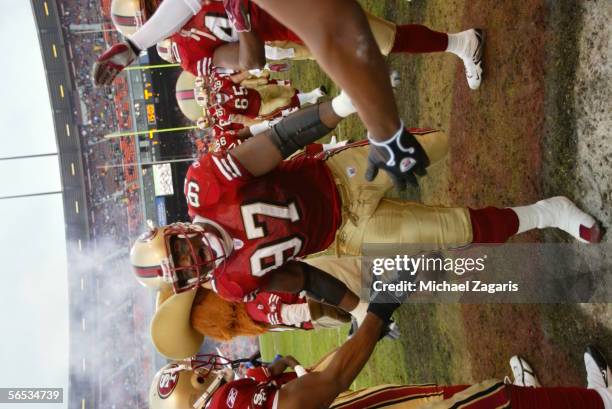Bryant Young of the San Francisco 49ers enters the field before the game against the Houston Texans on January 1, 2006 at Monster Park in San...