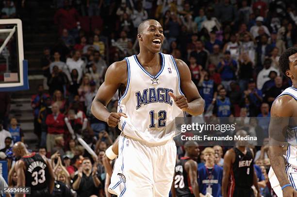 Dwight Howard of the Orlando Magic laughs while running upcourt during their NBA game against the Miami Heat at TD Waterhouse Centre on November 26,...