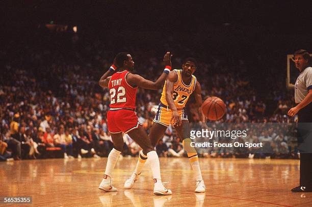 Center Magic Johnson of the Los Angeles Lakers passes the ball circa the 1980's during an NBA All-Star Game.